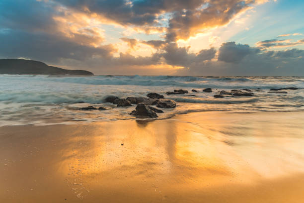 istock Cloudy Sunrise Seascape with Big Seas 908140920