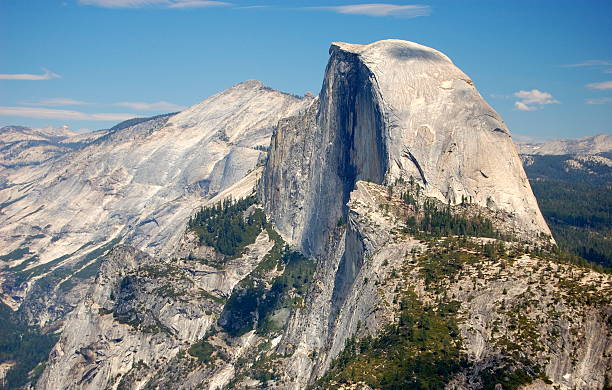The Dome Mountains with one looking like it was cut in half Half Dome in Yosemite National Park. mariposa county stock pictures, royalty-free photos & images