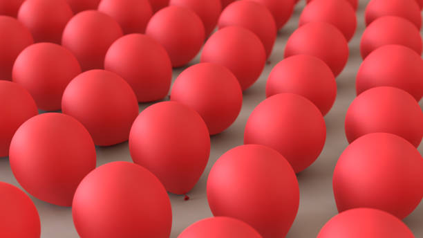 istock Red Balloons in an Even Grid on a Simple Concrete Surface 908150840