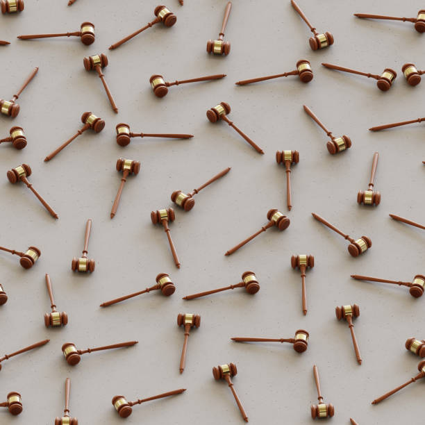 istock Isometric wooden gavels in a Tight Grid on a Simple Concrete Surface 908150926