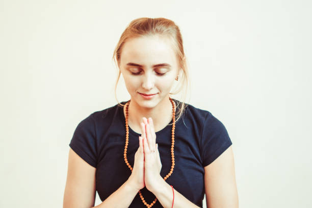 istock the girl palms together 908154722