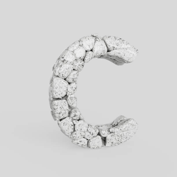 istock Upper Case Letter C Made of Smooth Stones on a White Background 908161650