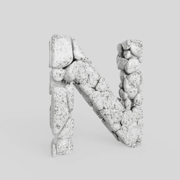 istock Upper Case Letter N Made of Smooth Stones on a White Background 908161674
