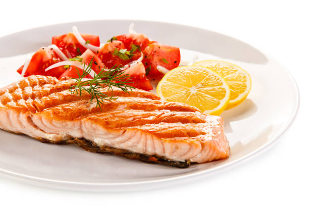 istock Fish dish - salmon steak and vegetables 908165156