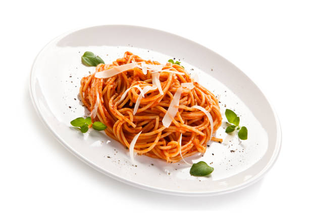 istock Pasta with meat and vegetables on white background 908165204