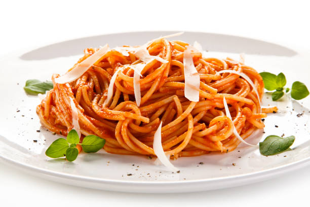 istock Pasta with meat and vegetables on white background 908165214