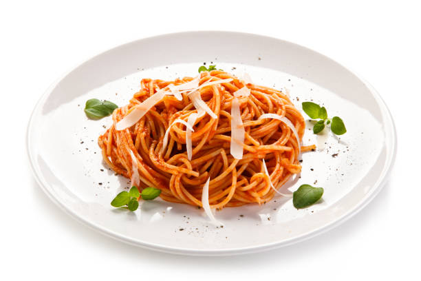istock Pasta with meat and vegetables on white background 908165460