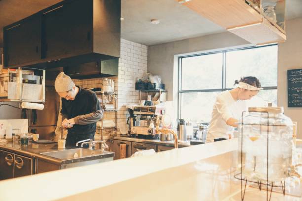 istock Young woman and man working at cafe 908168364