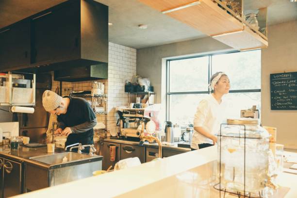 istock Young woman and man working at cafe 908168368