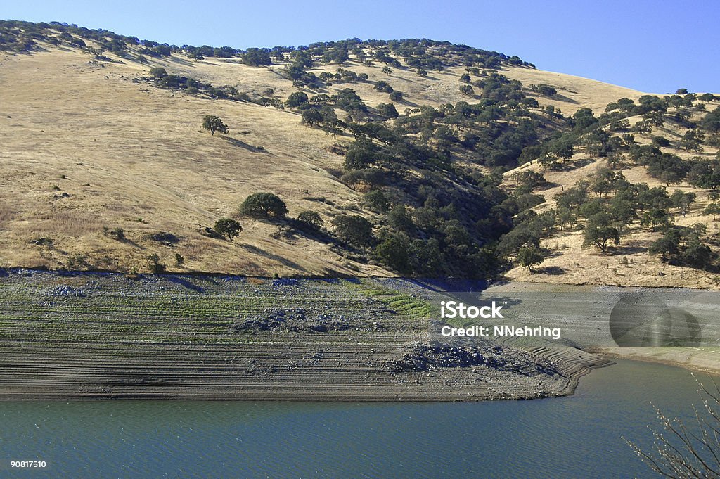 low water in reservoir during drought in California  California Stock Photo