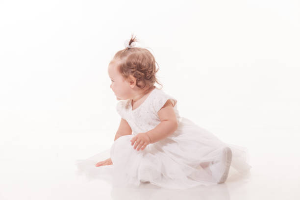 istock Happy baby girl over white background 908182656