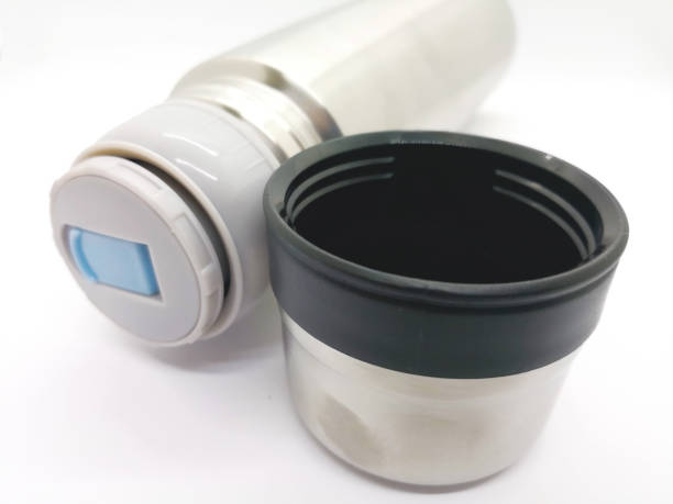 istock The silver thermos flask isolated on white background and copy space. Focus on foreground. 908186390