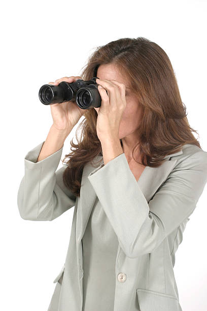 istock Beautiful Woman Looking Through Binoculars 90818677