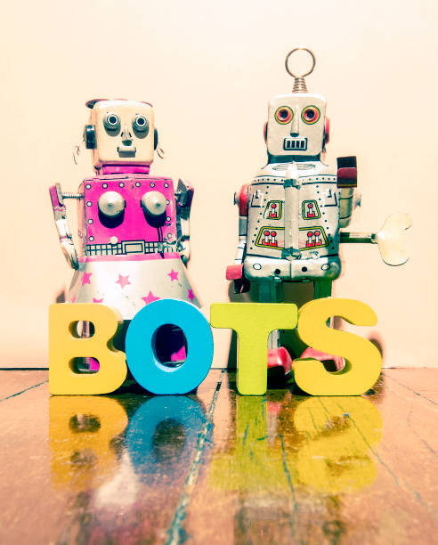 istock two retro robot toys and the word BOTS 908196178
