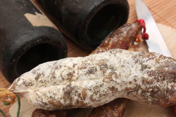 istock Sausage Chorizo bottles of old wine 908197166