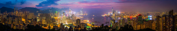 istock Hong Kong skyscraper cityscape harbour panorama glittering at sunset China 908198404