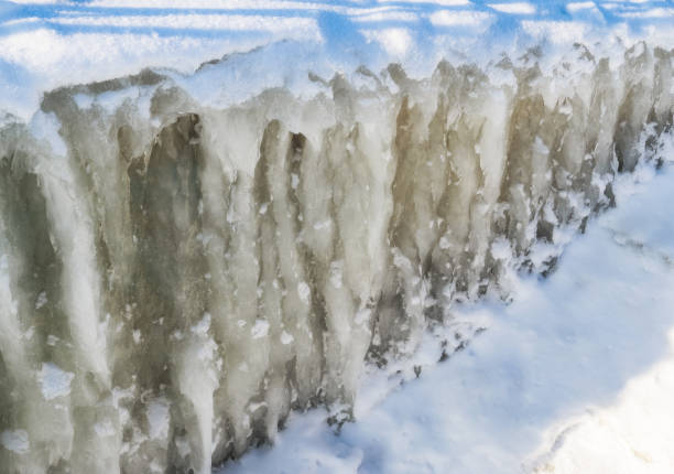 istock Ice wall.First rays of the sun.After the storm. 908207806