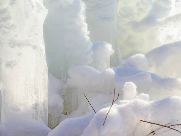 istock Spring is approaching.Ice wall.First rays of the sun.After the storm. 908207812