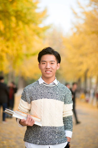 male Student Walking Across Campus