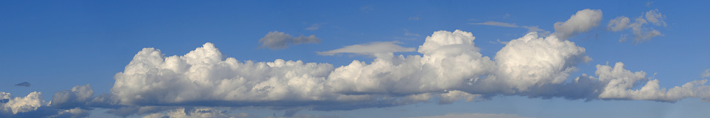 Panoramic view of Cumulus clouds against a blue sky