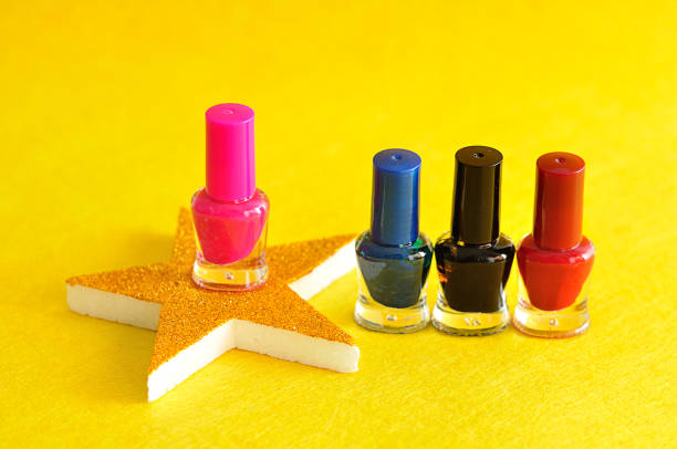istock Colorful nail polish displayed with a golden star 908209662