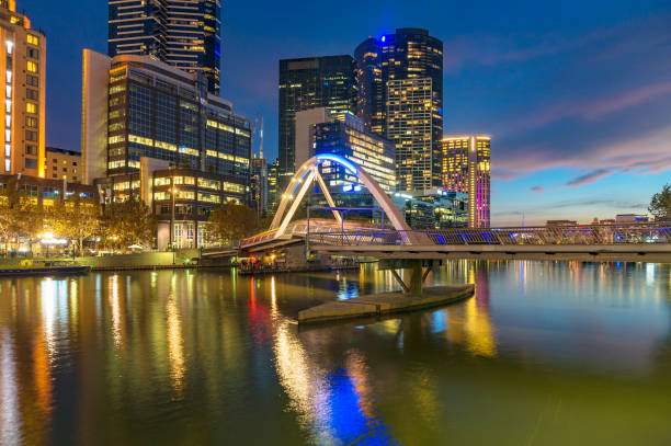 istock Beautiful cityscape at night with bridge across river 908210516