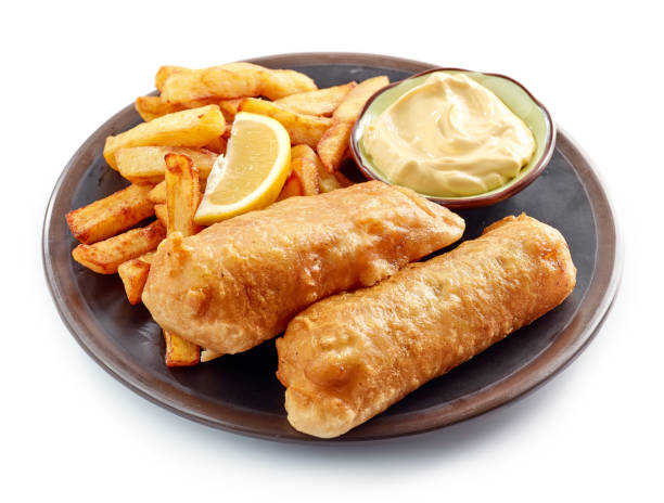 istock Plate of Fish and Chips isolated on white 908212846