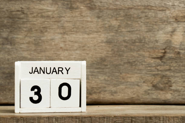 istock White block calendar present date 30 and month January on wood background 908213464
