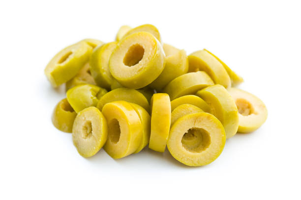 pitted green olives sliced green olives on white background green olive fruit stock pictures, royalty-free photos & images