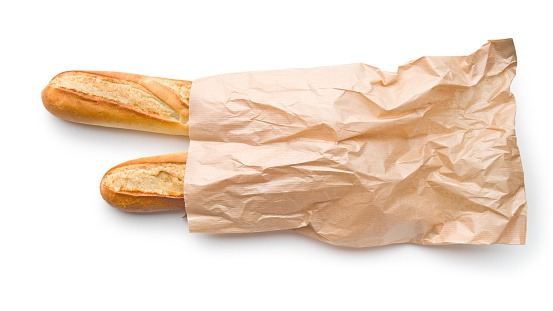 french baguettes in paper sack on white background