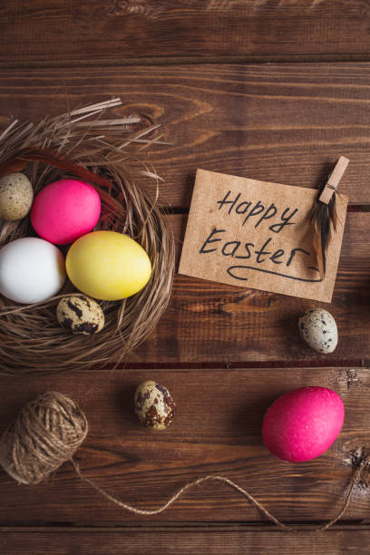 istock Easter eggs on rustic wooden background . Easter greeting card 908216946