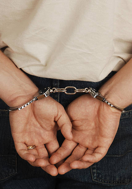 istock Person in handcuffs having been arrested 90821756