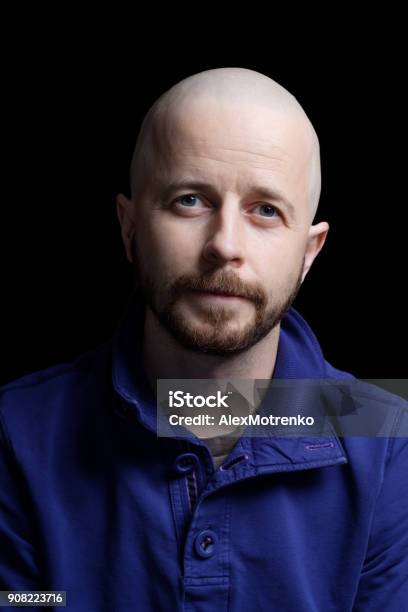 Young Bald Man In His 30s Isolated On Black Background Stock Photo - Download Image Now