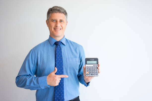 istock Smiling accountant showing calculator 908223904
