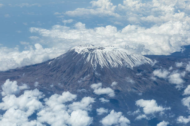 Mount Kilimanjaro An aerial view of Mount Kilimanjaro, taken from the flight deck of an airplane dormant volcano stock pictures, royalty-free photos & images
