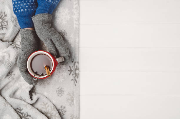 istock Hand holding cup of tea. Top view with copy space 908227722
