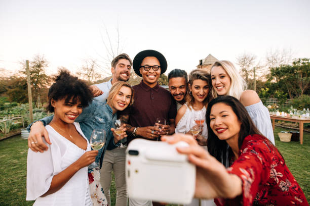 istock Group selfie at outdoor party 908234336