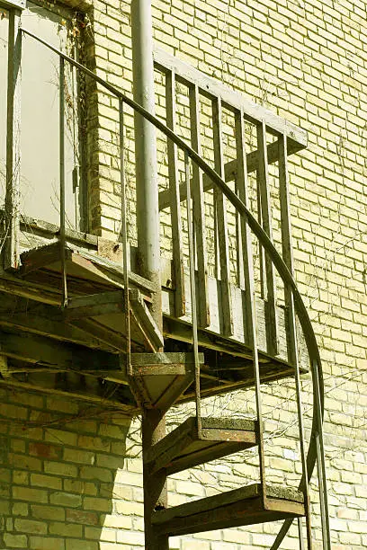 Photo of Spiraling staircase at the side of a building