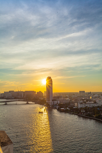 aerial view sunset above Pinklao bridge crossing the Chao Phraya River in Bangkok Thailand.