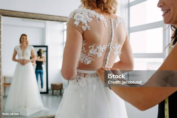 Making Final Touch On Tailor Made Gown In Bridal Shop Stock Photo - Download Image Now