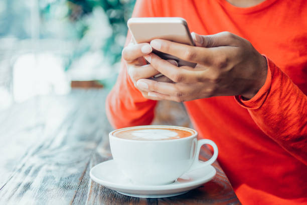 istock Close-up of unrecognizable woman using smartphone 908238412