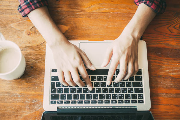 istock Unrecognizable woman working on student research 908238482