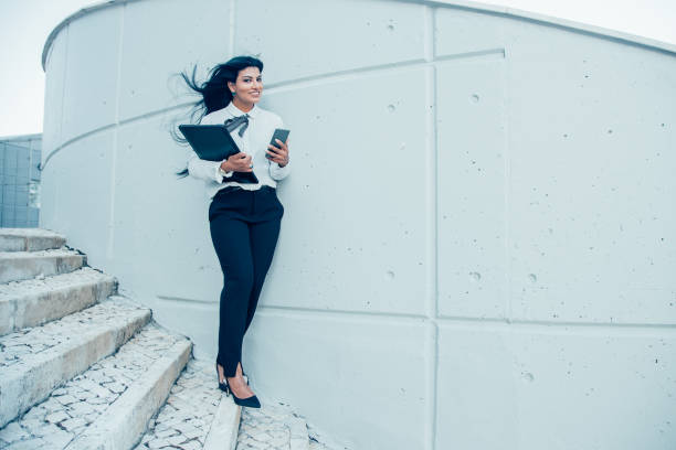 istock Cheerful business lady always connectable 908241376