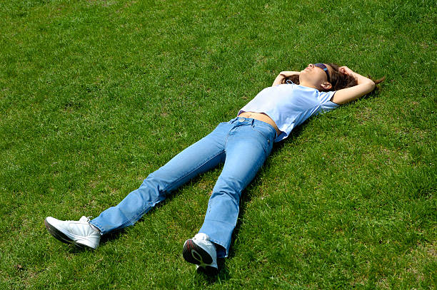 istock Girl lie in grass summer nature relaxed 90824157