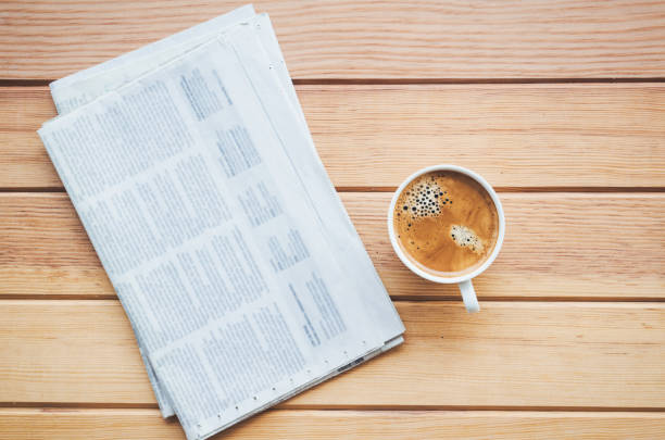 istock cup of coffee with Newspaper 908241664