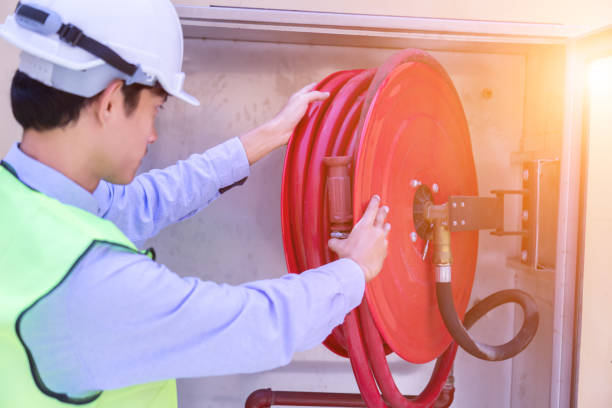 istock Watercourse fire extinguisher red ready to use in the outdoor. 908244798
