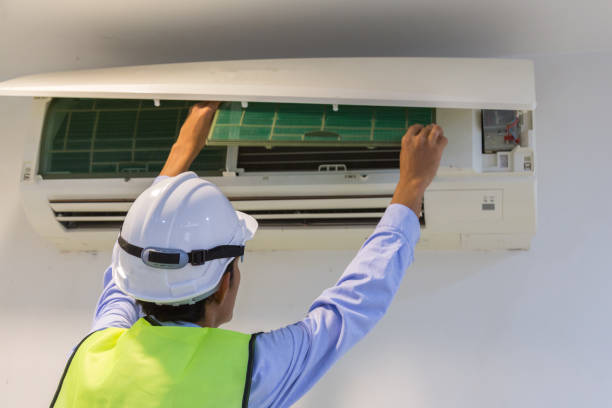 istock specialist cleans and repairs the wall air conditioner 908244932