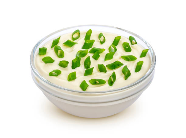 istock Sour cream and green onion isolated on white background 908245000