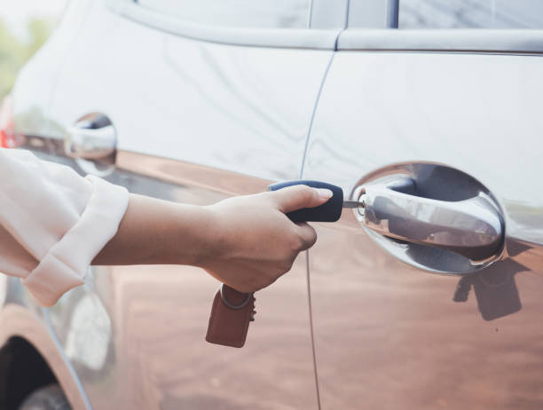 istock Woman with car key 908245092
