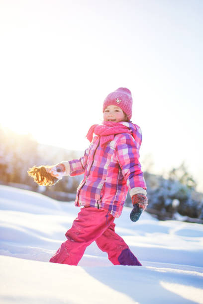 istock little girl in snow 908248156